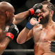 Kamaru Usman of Nigeria punches Jorge Masvidal of the United States during the Welterweight Title bout of UFC 261 at VyStar Veterans Memorial Arena on April 25, 2021 in Jacksonville, Florida.